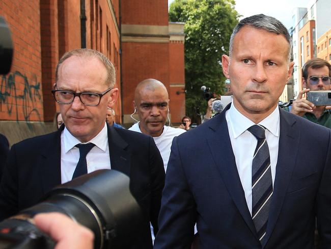 Former Manchester United star and Wales manager Ryan Giggs leaves the Manchester Minshull Street Crown Court, in Manchester, on August 8, 2022 at the start of his trial for assaulting his ex-girlfriend. - Giggs stands trial on charges of attacking and coercively controlling his ex-girlfriend, in a case that has upended his managerial career. The 48-year-old, who until recently served as coach of the Wales national team, has pleaded not guilty to the charges, which carry a maximum jail term of five years. (Photo by Lindsey Parnaby / AFP)