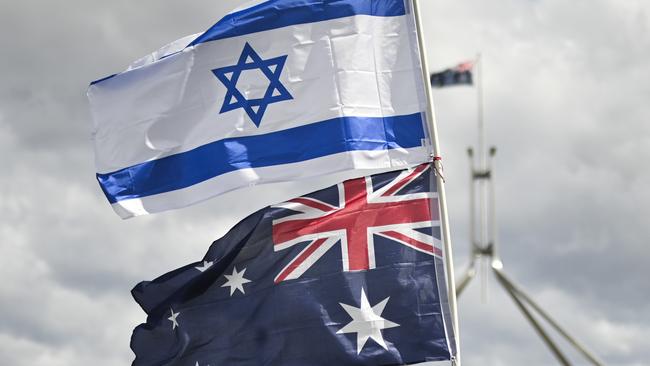 CANBERRA, Australia - NewsWire Photos - October 7, 2024: Thousands of attendees gather at Parliament House in Canberra taking an historic stand against antisemitism and to stand in support of Israel.  Picture: NewsWire / Martin Ollman