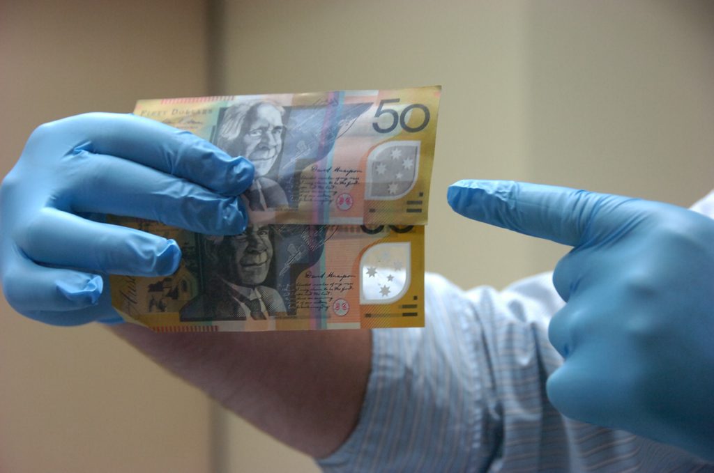 Gold Coast beauty salon owner was scammed when handed fake money