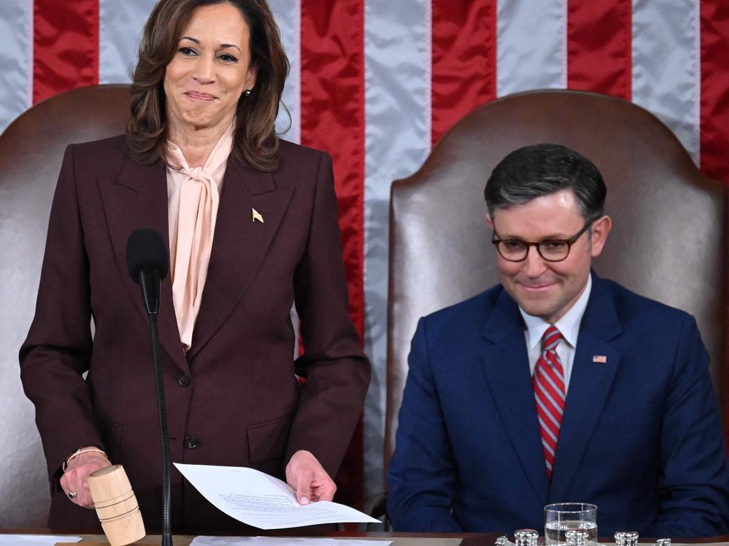 US Vice President Kamala Harris hits the gavel after reading the vote totals as Speaker of the House Mike Johnson looks on during of a joint session of Congress. Picture: AFP