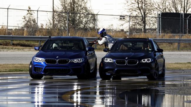A BMW M5 is refuelled on the run during a world record attempt. Pic: Supplied.