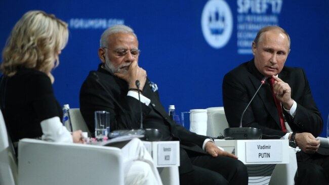 Ms Kelly said the Russian leader switched on to be “whatever he thinks you want him to be” and recounted one moment with him and Indian Prime Minister Narendra Modi (pictured middle) at what she thought was a large group dinner. Picture: Getty Images
