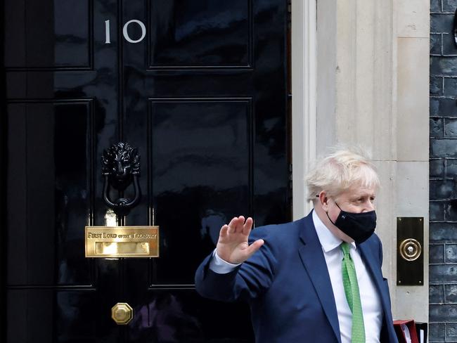 Boris Johnson, wearing a face covering to help mitigate the spread of coronavirus, has come under fire for an “inconsistent” approach to the pandemic. Picture: AFP