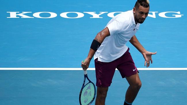 Nick Kyrgios of Australia plays a backhand in his Mens Singles match against Grigor Dimitrov of Bulgaria  during the Kooyong Classic at the Kooyong Lawn Tennis Club in Melbourne, Thursday, January 16, 2020. (AAP Image/Sean Garnsworthy) NO ARCHIVING, EDITORIAL USE ONLY