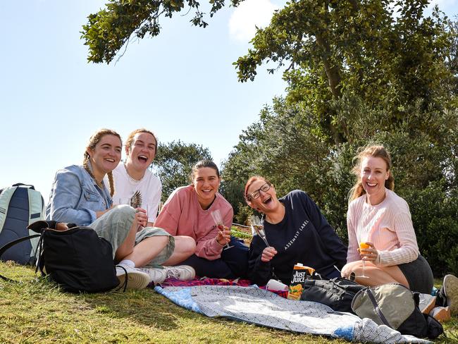 SYDNEY, AUSTRALIA - NewsWire Photos , September 13, 2021: Nurses from Sydney Children's Hospital, Randwick having picnics as double vaccinated persons are allowed to gather in five or more outdoors at Dunningham Park, Coogee Beach in SydneyL-R, Sean Pay; Zoe Whitehouse; Olivia Parmenter; Amanda Pritchard and Liz Foat. Picture: NCA NewsWire / Flavio Brancaleone