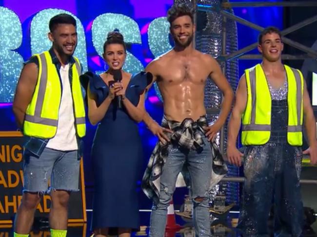 In Dance Boss, teams of everyday workers battle it out on the dance floor for a cash prize of $100,000. Here construction workers flank host Danni Minogue. Picture: 7plus