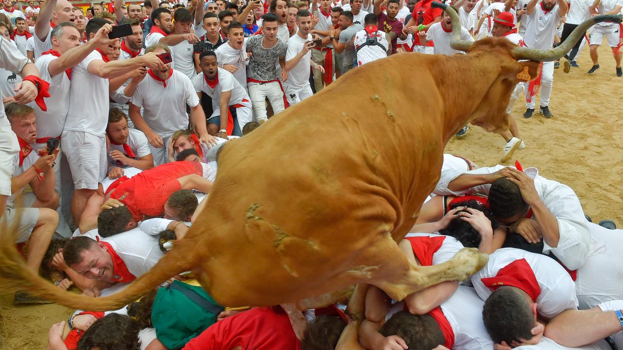 Putting yourself in harm’s way is all part of the experience of San Fermin. Photo: Ander Gillenea/AFP