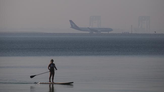 Thick smoke as a result of hazard reduction in Sydney seen blanketing Sydney Airport this morning. Picture: Dylan Robinson