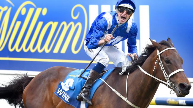 Whoosh: Hugh Bowman rides Winx to the line to win her second Cox Plate. Picture: Nicole Garmston