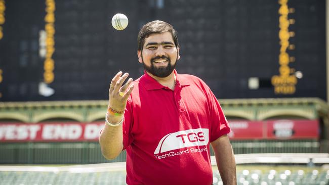 Security guard Vikas Chhikara, who caught Heat batsman Joe Burns’ six on the fence line during Wednesday night’s Strikers v Heat Big Bash game at Adelaide Oval. Picture: Mike Burton