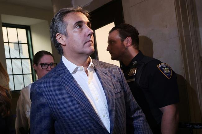 Donald Trump's former lawyer Michael Cohen arrives to testify at the civil fraud trial of his ex-boss