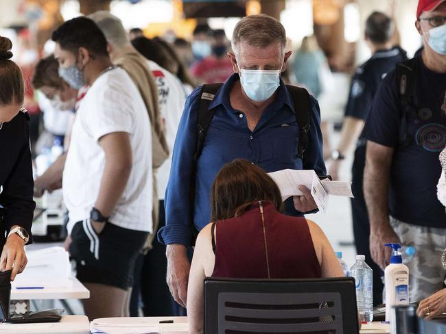 All people coming from Sydney being checked by Police upon arrival at Brisbane Domestic Airport, Brisbane, 21st of December 2020. (News Corp/Attila Csaszar)