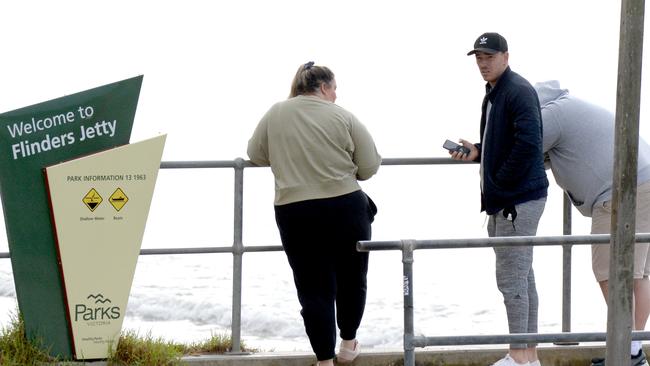 Hibberd waits for news at Flinders jetty. Picture: Andrew Henshaw