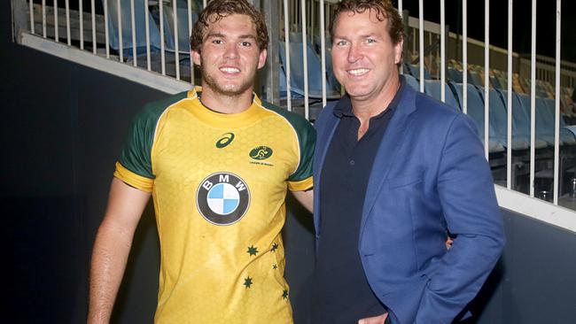 Former Wallaby Sam Scott-Young with his son Angus.