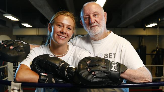 DAILY TELEGRAPH 29TH OCTOBER 2023Pictured at Sydney Uni Sports and Aquatic Centre at Darlington in Sydney is boxer Ella Boot with her trainer Johnny Lewis.Ella is a rising boxing star who moved from Noosa to Sydney just to be trained by legendary trainer Johnny Lewis, who says she will win a world title.Picture: Richard Dobson