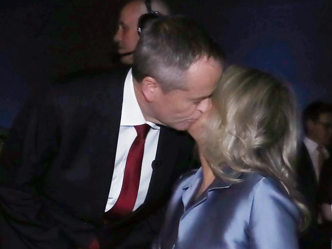 Opposition Leader Bill Shorten kisses his wife Chloe Shorten before the start of the forum last night. Picture: Gary Ramage/News Corp Australia