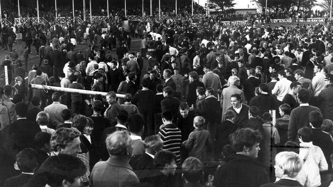 In 1967, North Hobart full forward Dickie Collins prepared to take his kick, about 10 yards from goal. Then 3000 of the crowd watching the Tasmanian State football final between North Hobart and Wynyard swarmed on the ground and tore down the goalposts. One of the goalposts is carried away by the crowd.