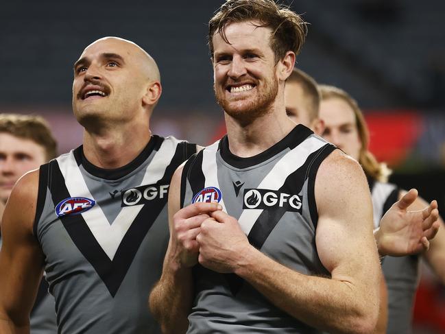 MELBOURNE, AUSTRALIA - AUGUST 14: Tom Jonas of the Power and Sam Powell-Pepper of the Power celebrate winning the round 22 AFL match between the Essendon Bombers and the Port Adelaide Power at Marvel Stadium on August 14, 2022 in Melbourne, Australia. (Photo by Daniel Pockett/Getty Images)