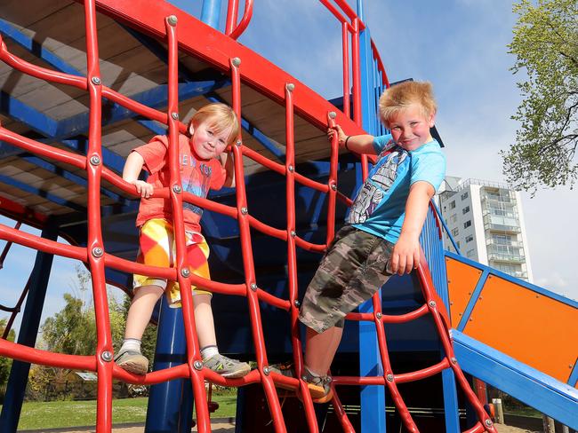 Brothers Oliver and Kobi Scolyer, of Lauderdale, enjoying the play equipment at Princes Park playground, Battery Point.