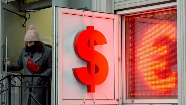 People are desperate to withdraw hard currency as the rouble plummets in value. Picture: AFP