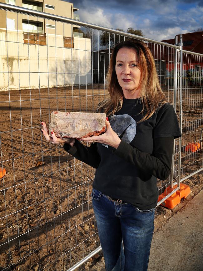 Julie Marrington with a brick from the Greyhound. Picture: Hamish Blair