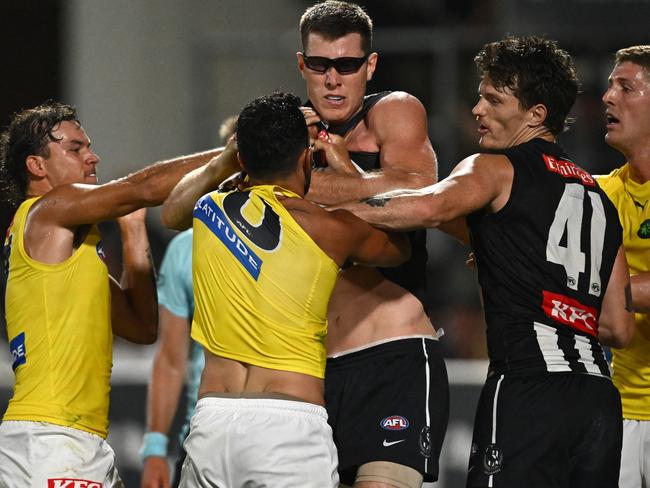 MELBOURNE, AUSTRALIA – FEBRUARY 27: Marlion Pickett of the Tigers and Mason Cox of the Magpies wrestle during the 2024 AFL Community Series match between Collingwood Magpies and Richmond Tigers at Ikon Park on February 27, 2024 in Melbourne, Australia. (Photo by Quinn Rooney/Getty Images)