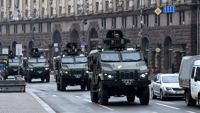 Ukrainian military vehicles move past Independence square in central Kyiv. Picture: AFP.