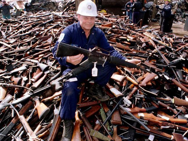 September 8, 1996: An armalite rifle similar is held up, similar to the one used in the Port Arthur massacre, after it was handed in as part of a national firearms amnesty. Picture: AFP