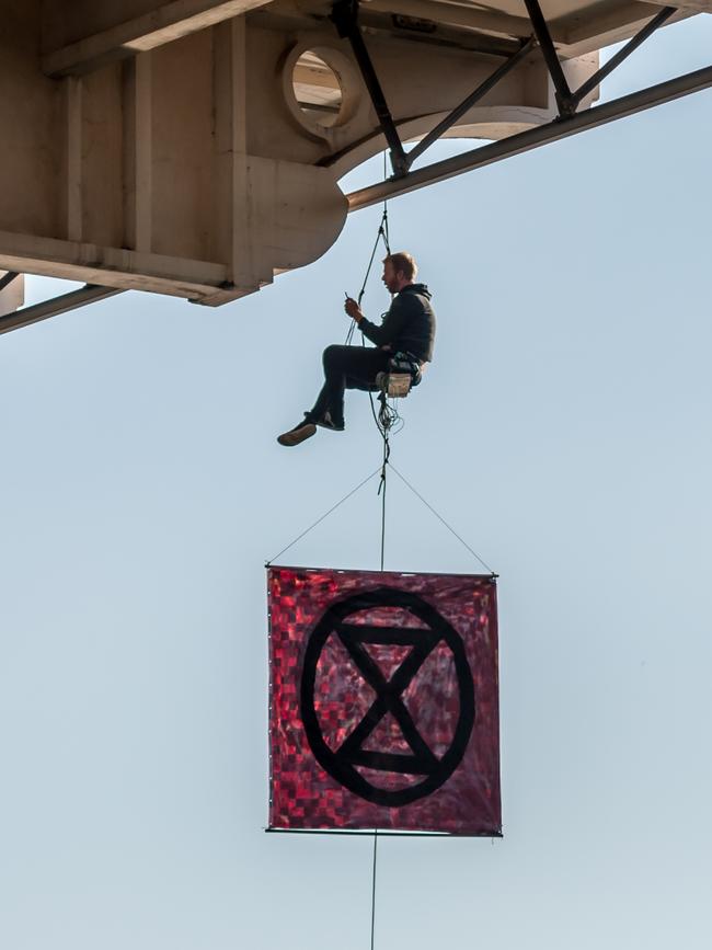 An Extinction Rebellion protester who abseiled off William Jolly Bridge in Brisbane’s CBD on August 19. Picture: Supplied.