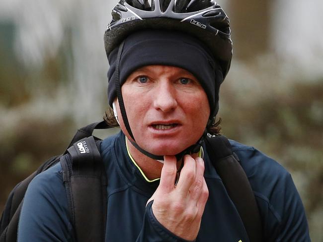 Essendon recovery at St Kilda sea baths. Essendon coach James Hird arrives at recovery on his push bike  . Pic: Michael Klein