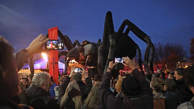 The Tasmanian cave spider shaped Ogoh-Ogoh is paraded through Morrison St on its way to Dark Park. Picture: LUKE BOWDEN