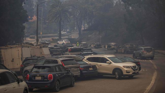 Vehicles are left behind on Sunset Boulevard after their occupants became stuck in traffic while evacuating from the Palisades Fire. Picture: Apu Gomes/Getty Images/AFP