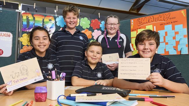 Ysabella Wright, 10, Jake Kilgallon, 11, Orlando Wade, 10, Claire Thomas, 11, and Eli Iversen, 10 at South Port Primary School in Port Noarlunga South, with postcards to the Commissioner, Friday, July 26, 2024. Picture: Matt Loxton