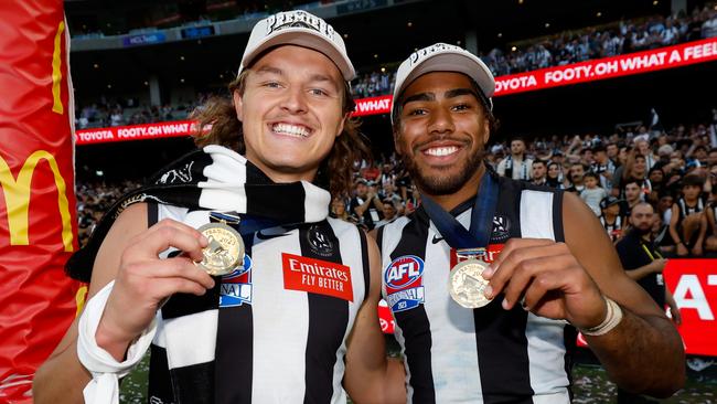 MELBOURNE, AUSTRALIA - SEPTEMBER 30: Jack Ginnivan and Isaac Quaynor of the Magpies pose for a photo with their premiership medals during the 2023 AFL Grand Final match between the Collingwood Magpies and the Brisbane Lions at the Melbourne Cricket Ground on September 30, 2023 in Melbourne, Australia. (Photo by Dylan Burns/AFL Photos via Getty Images)