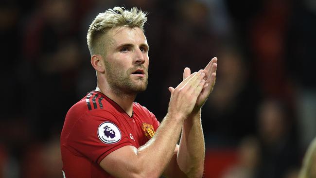 (FILES) In this file photo taken on August 10, 2018 Manchester United's English defender Luke Shaw gestures after the English Premier League football match between Manchester United and Leicester City at Old Trafford in Manchester, north west England. - England left-back Luke Shaw has ended speculation over his future by signing a new five-year deal with Manchester United, the club announced on October 18, 2018. (Photo by Oli SCARFF / AFP) / RESTRICTED TO EDITORIAL USE. No use with unauthorized audio, video, data, fixture lists, club/league logos or 'live' services. Online in-match use limited to 120 images. An additional 40 images may be used in extra time. No video emulation. Social media in-match use limited to 120 images. An additional 40 images may be used in extra time. No use in betting publications, games or single club/league/player publications /