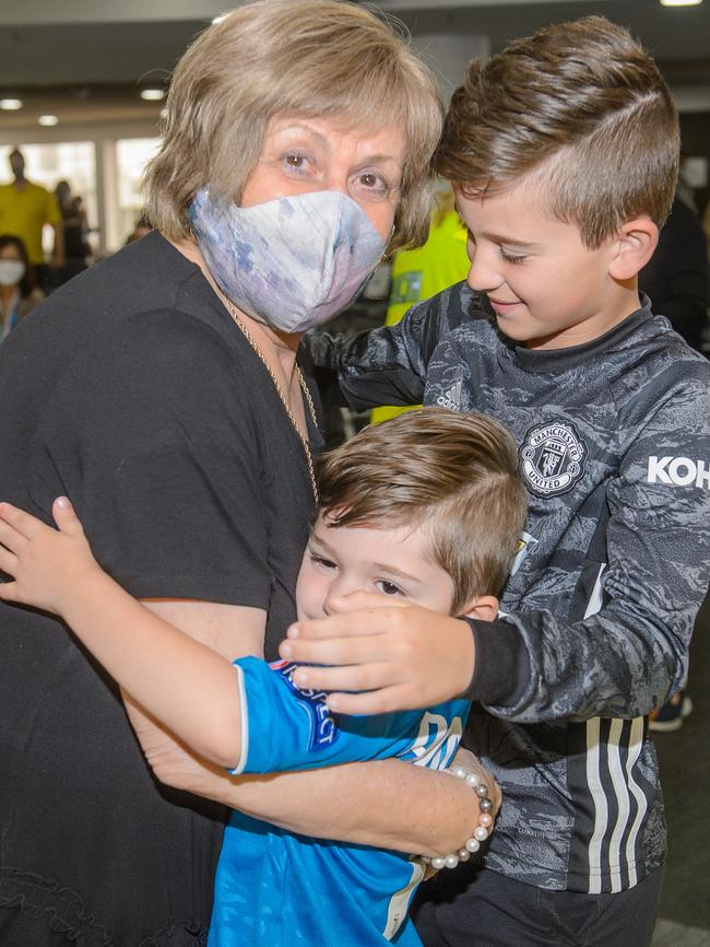 Bruna Battistella gets a big hug from her grandsons Levi and Dion. Picture: Jay Town