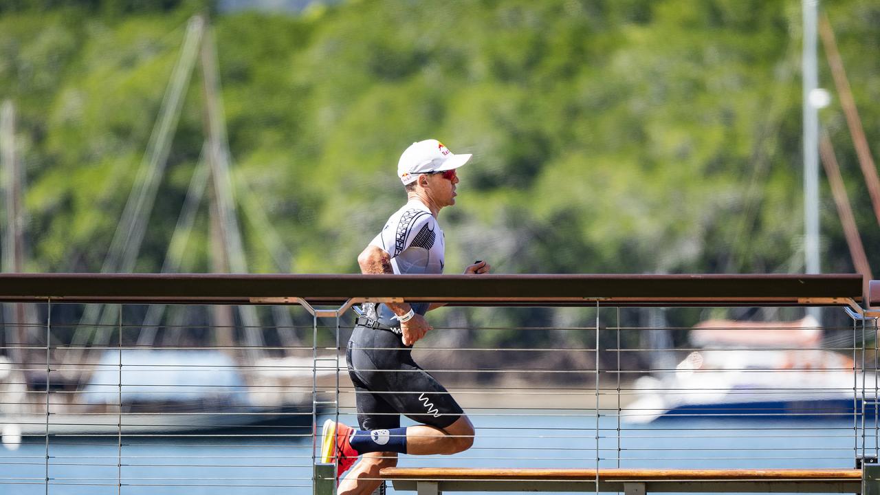 Cairns Iron Man - Braden Currie LEADS during the run leg along the waterfront. Picture: Brian Cassey