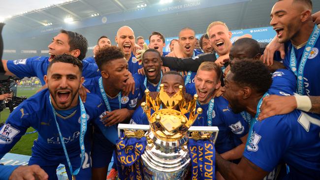 Leicester players with the EPL trophy.