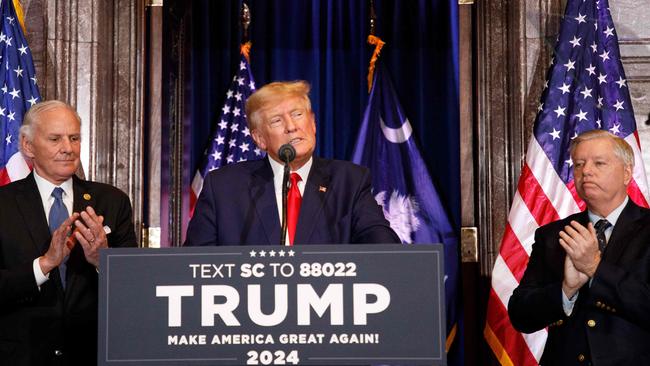 Former US President Donald Trump, joined by US Senator Lindsay Graham (R), and South Carolina Governor Henry McMaster (L), speaks at a 2024 election campaign event in Columbia, South Carolina. Picture: AFP. AFP)