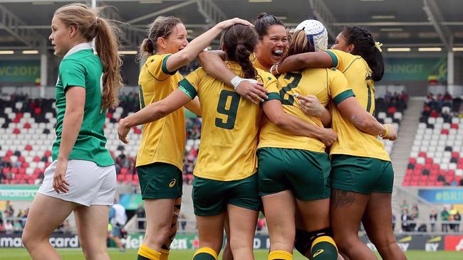 Supplied image of Australian captain Sharni Williams (second right) celebrating with teammates after scoring the opening try in their Women's Rugby World Cup 2017 fifth place semi-final against Ireland at Kingspan Stadium in Belfast, Northern Ireland, Tuesday, August 22, 2017. (AAP Image/Women's Rugby World Cup/INPHO, Dan Sheridan) NO ARCHIVING, EDITORIAL USE ONLY