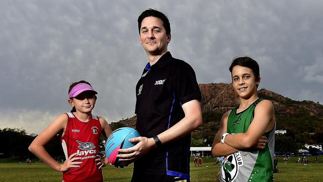 Kerrod Hall is president of the Townsville Junior Touch Football Association, pictured with Tia Crowley, 13, and Ethan Stout, 13. PICTURE: MATT TAYLOR.