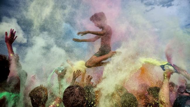 A group of young boys enjoy a colourful flash mob on the beach in Italy, celebrating the joy of rebirth and experiencing the feeling of freedom after the lifting of Covid-19 pandemic restrictions. Picture: Alberto Cicchini