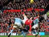 FILE - A Saturday, Feb. 12, 2011 photo from files showing Manchester United's Wayne Rooney, centre, scoring his sides second goal from inside the penalty area from an overhead kick, during their English Premier League soccer match against Manchester City at Old Trafford Stadium, Manchester, England. Manchester United striker Wayne Rooney's spectacular overhead kick against Manchester City has been voted the greatest goal in the history of the English Premier League. Rooney's sensational strike, which sealed a 2-1 derby victory for United at Old Trafford in February 2011, was on a shortlist of 10 goals in a poll organized by the Premier League to celebrate its 20th anniversary. (AP Photo/PA, Martin Rickett, File)UNITED KINGDOM OUT NO SALES NO ARCHIVE Picture: Ap