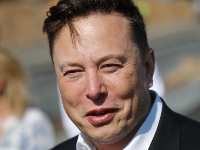 (FILES) In this file photo taken on September 03, 2020 Tesla CEO Elon Musk talks to media as he arrives to visit the construction site of the future US electric car giant Tesla, in Gruenheide near Berlin. - Tesla chief Elon Musk told investors on October 7, 2021 that the leading electric vehicle maker is moving its headquarters from Silicon Valley to Texas. "I'm excited to announce that we're moving our headquarters to Austin, Texas," Musk said at an annual shareholders meeting. (Photo by Odd ANDERSEN / AFP)