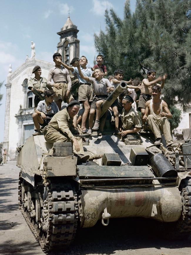 Children aboard a Sherman tank of the 3rd County of London Yeomanry in Sicily, August 1943. Picture: Imperial War Museum