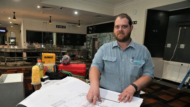 Dunwoody's Cairns duty manager Craig Shepard looks over plans for a multimillion dollar refit of the Sheridan St sports bar. Picture: Peter Carruthers