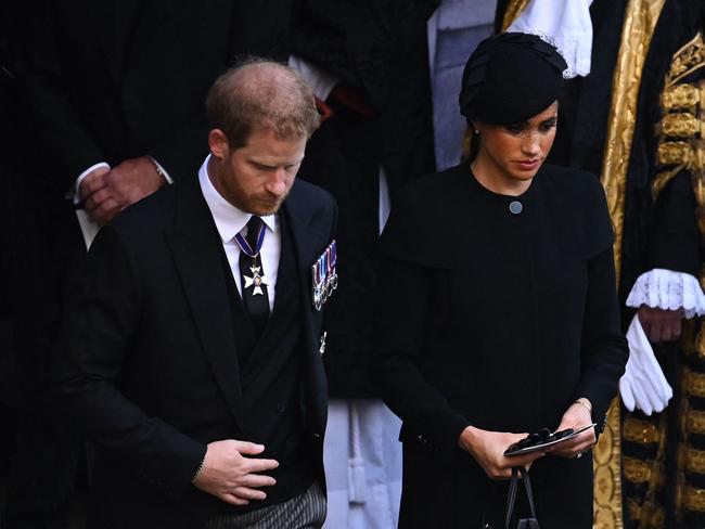 Prince Harry, pictured with Meghan Markle at the Queen’s funeral, was ‘wracked by guilt’ at missing the big sleepover. Picture: AFP