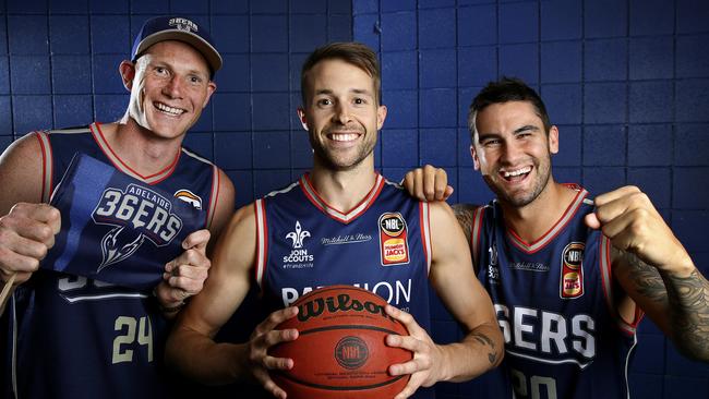 Adelaide 36ers guard Nathan Sobey (centre) with Crows ruckman Sam Jacobs (left) and Power star Chad Wingard. Picture: Sarah Reed