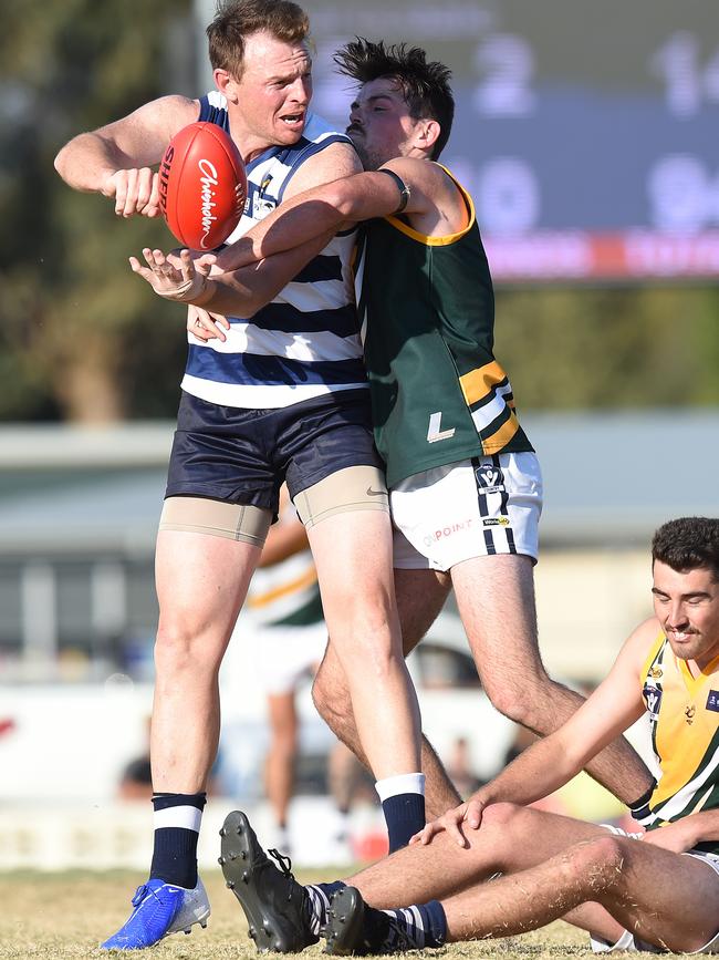 Goddard gets a handball away. Picture: Josie Hayden