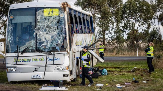 Schoolbags and bus parts are strewn across the crash site. Picture: Jake Nowakowski